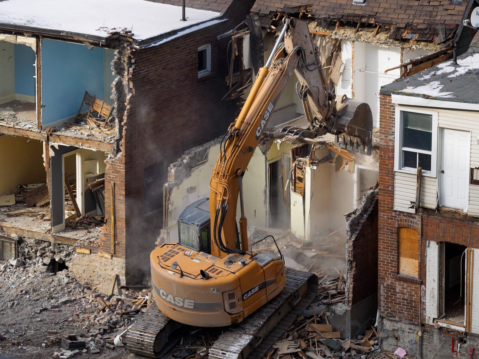 Excavator demolishing a building structure