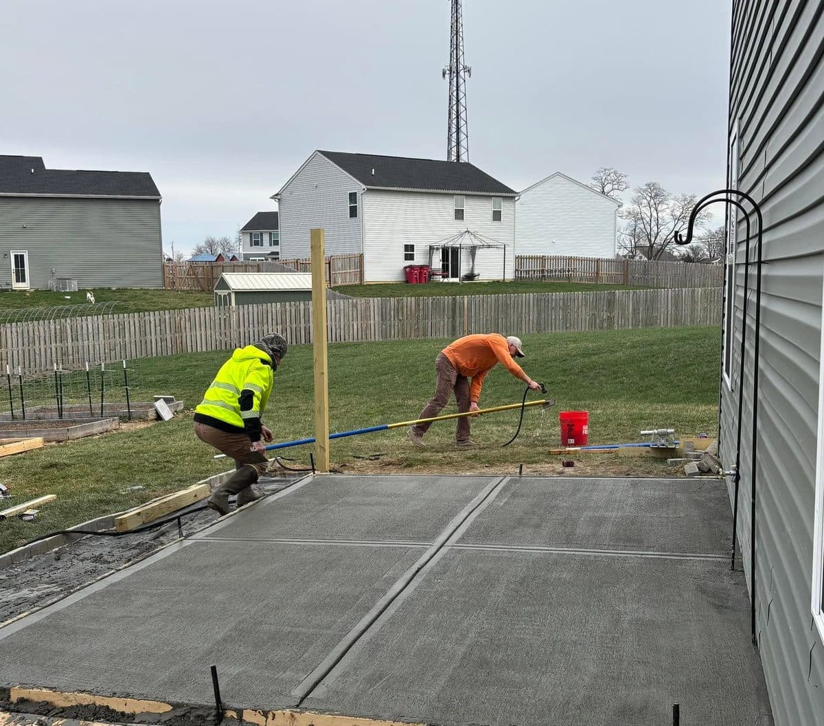 Apex crew setting up a concrete patio pour